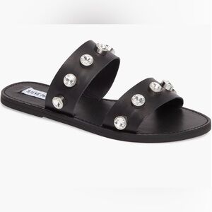 Bejeweled straps add a luxe look to easy slip-on sandals.